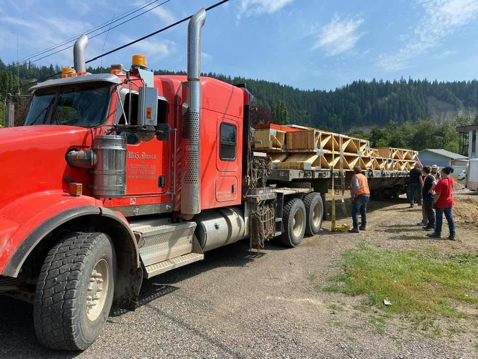 W.G. Davis Red Truck Transporting Cargo